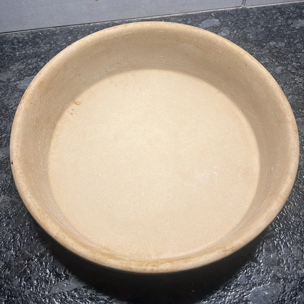 8” stone baker by Pampered Chef. Stone is partially seasoned since used.